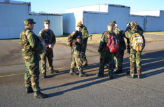 Cadets perform gear check before deploying.