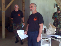 1st Lt Ron Watkins (left) finishes the Mission Briefing