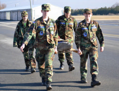 Cadets practice to properly carry a loaded litter.