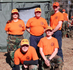 All proudly wear their shirts and hats at the conclusion of a successful training weekend.