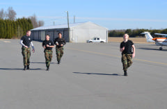 Cadets on final stretch in completing a half-mile run under six minutes.