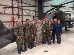 CAP cadets and senior members from the Orange County Composite Squadron (MER-NC-150) tour Apache helicopters with Chief Warrant Officer Chris Wilson at the Army Air National Guard hangar