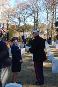 Cadet hands Marine wreath