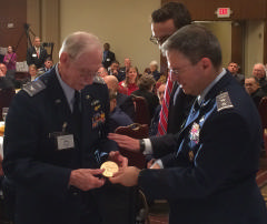 Col Martin Miller receiving the replica medal from Maj Gen Vazquez