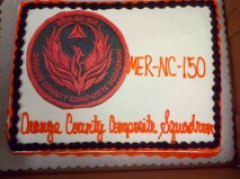The Orange County Comp Squadron celebrates with a special commemorative cake at the February 5, 2015 Change-in-Command ceremony.