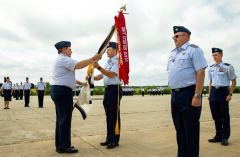 Col Bailey accepts flag at Change of Command