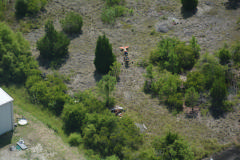 Aerial view of aircraft at crash site.