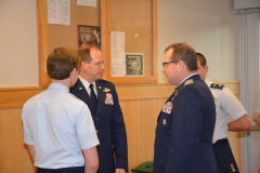 Gen Scanlan speaking with Capt Willis, C/Col Waters, and C/2nd Lt Barrow before the ceremony.