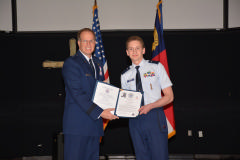 Gen Scanlan presenting the promotion certificate and orders to C/2nd Lt Barrow. 