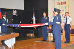NC Wing Honor Guard member C/Capt Willis and C/2nd Lt Holmes fold the flag that was flown over the U.S. Capitol for C/Col Waters.