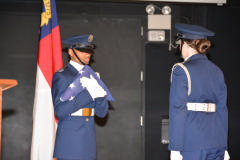 C/2nd Lt Holmes prepares to give the flag to C/Capt Willis.