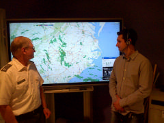 Sgt Ian Fowler of Orange County Emergency Services demonstrates the national weather tracking map
