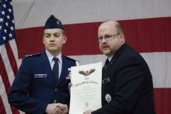 C/2nd Lt Sam Smith, left, receiving his Billy Mitchell Award from North Carolina Wing Commander David Crawford.
