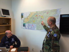 Lt Col Dion Viventi, Incident Commander reviewing the tasking map with Col Dave Crawford, Planning Section Chief