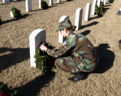 CAP NC-170 C/TSgt Abby Clemmons places a wreath on a veteran's grave site.