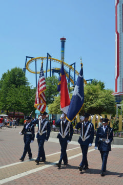 C/Maj Robertson (American flag) leads the Iredell Composite Squadron Honor Guard during the July 4 Carowinds Military Day in 2012.