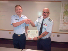C/Amn Lucas Todd receives his certificate for Outstanding Marksmanship at the NCWG 2015 Summer Encampment
