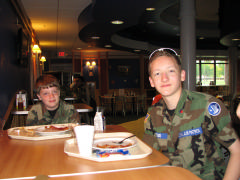 Cadet Jacob Rogers and C/Amn Lucas Todd eat at the Base dining hall 