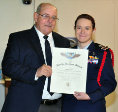 C/Capt Casey Carnes receives the Amelia Earhart Award from Lt Col Ron Cheek, Group 4 Commander