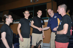Cadets receive commander's coin after performance